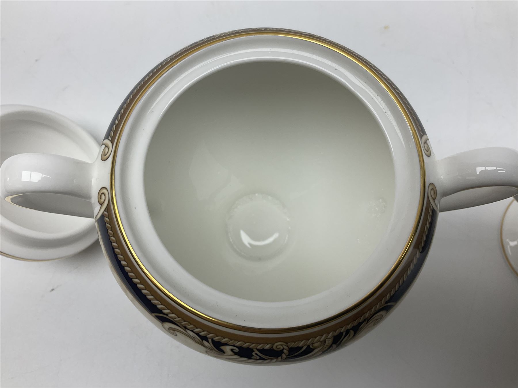 Wedgwood Cornucopia coffee service for six, comprising coffee pot, milk jug, twin handled covered sucrier, coffee cans and saucers