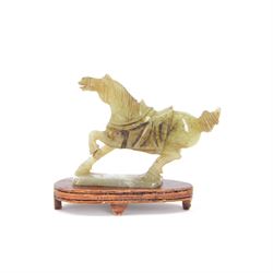 20th century Chinese jade figure of a horse, modelled with its front left leg raised, on a...