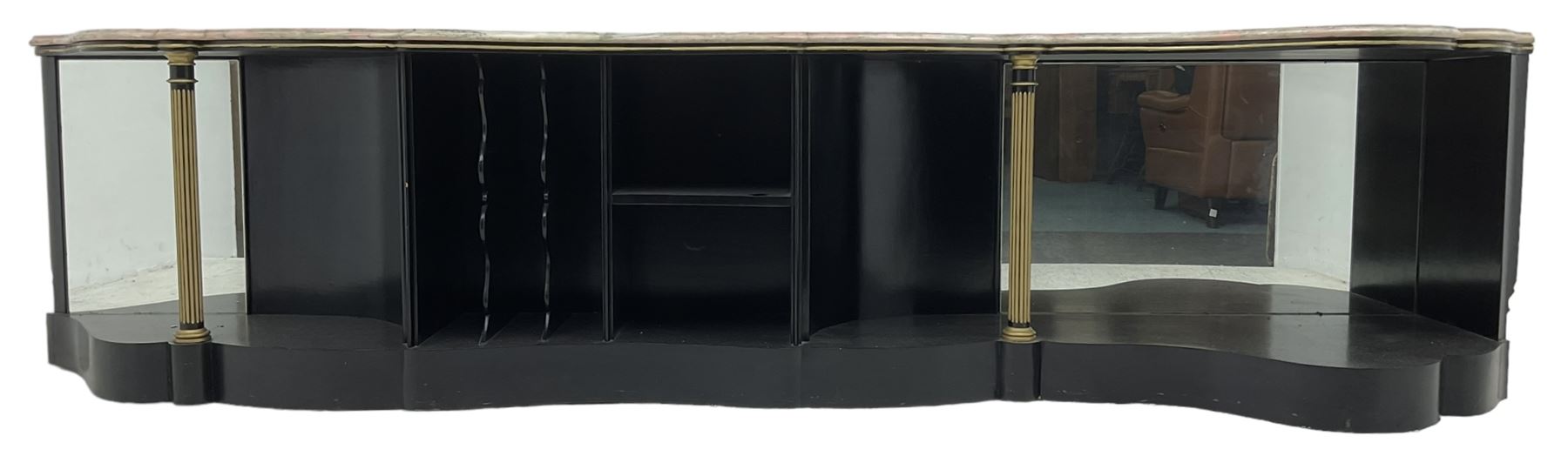 Italian ebonised and gilt serpentine corner console bookcase cabinet, shaped pink marble top over assorted shelves and dividers with fluted pilasters and mirror backs, on skirted base 