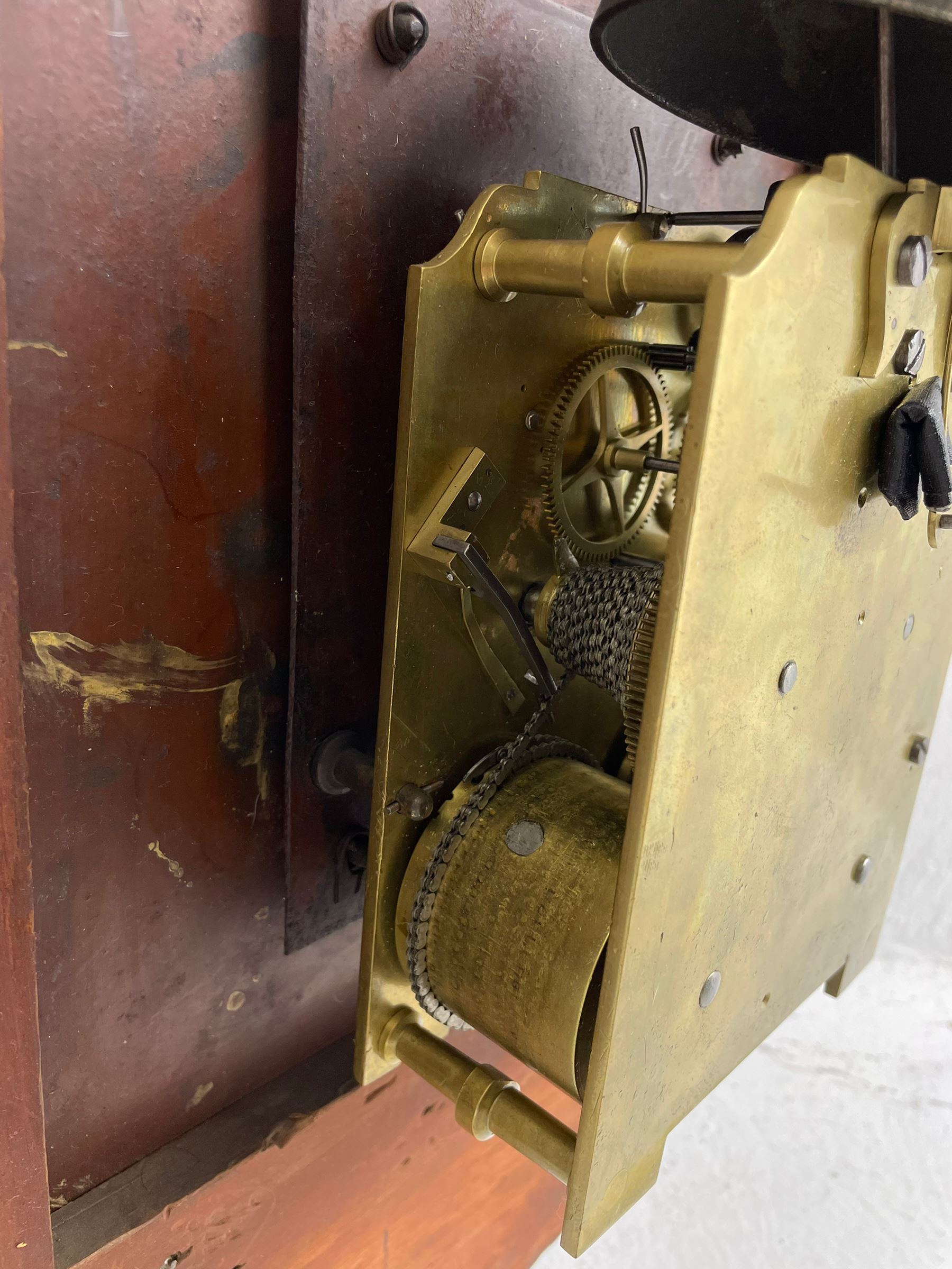 Joseph Critchley of Liverpool -  early 19th century twin fusee 8-day rosewood and mother of pearl inlaid drop-dial wall clock c1820, inlaid circular wooden dial surround with carved ears representing grapes and vine leaves, glazed box with a scroll carved surround, curved base and pendulum adjustment door, 14” painted dial with Roman numerals, minute track, and pierced steel hands within a cast brass bezel and flat glass, dial pinned to a four pillar chain driven fusee movement striking the hours on a bell. With pendulum and key.