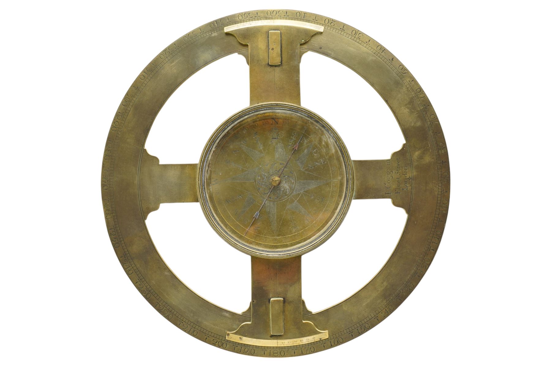 Ihon (John) Coggs of Fleet Street, London,- George II brass circumferentor (theodolite) c1730, housing a cylindrical glazed compass with a steel  indicating hand and engraved (formerly silvered) eight point compass rose to the centre, outer track divided into two-degree intervals and a subsidiary Arabic numeral chapter ring divided into ten minute intervals, mounted on a 12