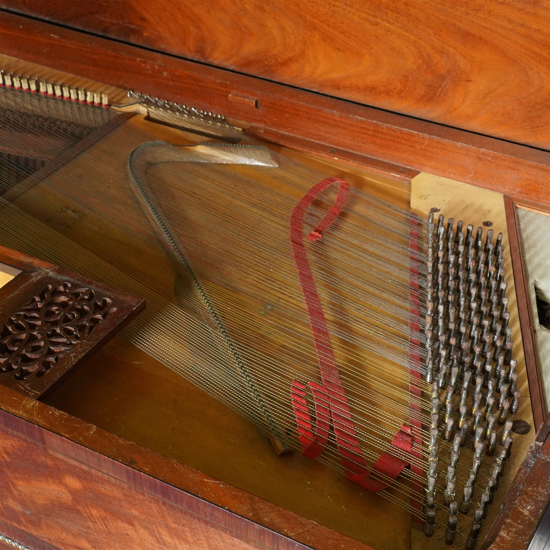 Early 19th century George IV Square Piano by William Rolfe & Co, 112 Cheapside, London, c1821. Mahogany veneered case with rosewood crossbanding and brass stringing, with sustain pedal and reeded legs on a tapered spiral with brass capitals, with three music draws beneath and a folding duet music stand, nameboard with makers name on a round gilt medallion and open silk backed fretwork to the ends, serial No 6699, double strung, English double action with 68 ivory and ebony keys, F1-C7. original strings, hammers and dampers, soundboard and bridge in good condition, with original makers written instructions on regulating the action and tuning the piano attached to the inside of the instrument. In good condition, however the action is in need of regulation and tuning.
William Rolfe is thought to have been in business between 1785 and 1828. 
Given the intricate nature of these historic instruments, specialist support will be available if required, to assist successful buyers with safe removal and onward handling. Price upon application.


This item has been registered for sale under section 10 of the APHA Ivory Act Reference PB6GL6SZ