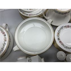 Royal Albert Paragon tea and dinner service for twelve decorated in the Belinda pattern, comprising fourteen saucers, twelve teacups, thirteen side plates, teapot, sauce boat and stand, salt and pepper shakers, two jugs, sucrier, twelve dinner plates, twelve smaller plates, two lidded tureens, twelve bowls, twelve smaller bowls, cake plate, oval plate and oval dish (100)
