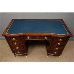  Edwardian twin pedestal mahogany and ebony inlaid desk, top inset with tooled blue leather writing surface, eight graduating curved drawers, one central drawer, square tapering supports on castors, W122cm, H76cm, D64cm  