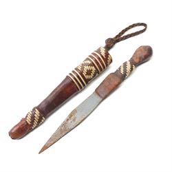 North African arm dagger with leather sheath and one other African dagger (2)