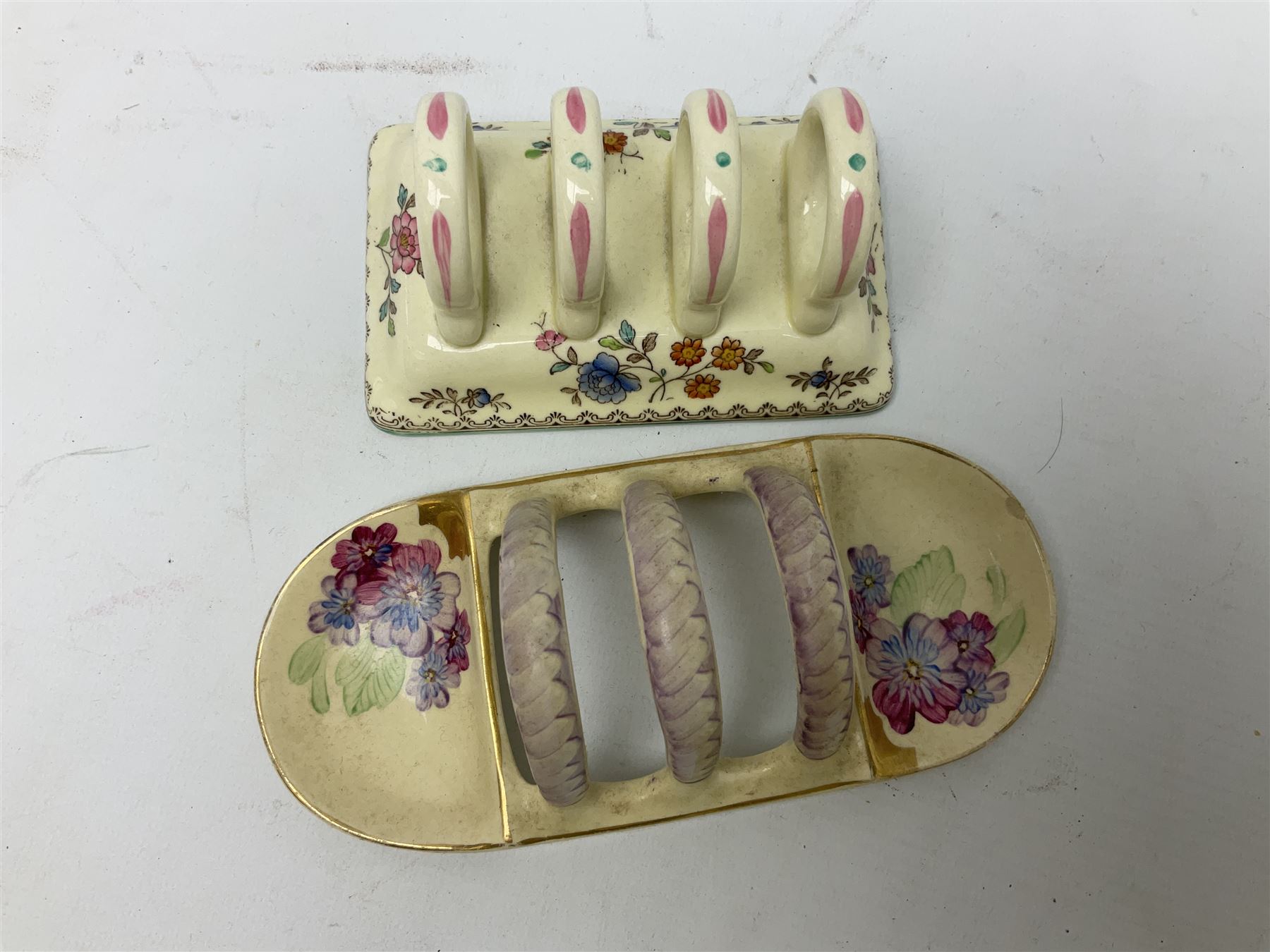 Collection of five toast racks comprising two Royal Winton Grimwades, Gray's Pottery, Copeland Spode Audley Royal Jasmine and another further early-mid 20th century toast rack decorated with flowers