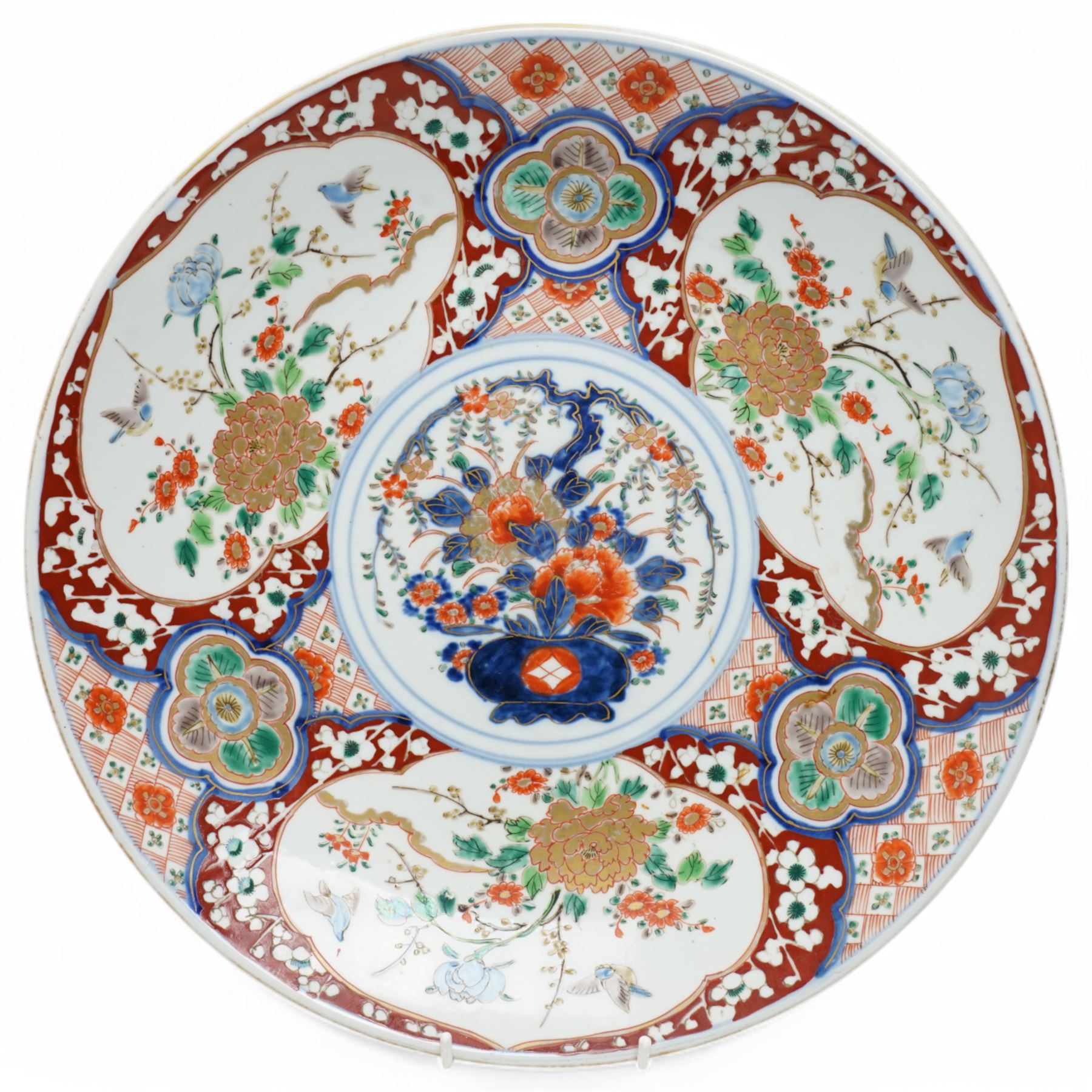 Japanese Imari charger decorated with panels of birds and flowers in orange, blue and red etc D37cm and two smaller Imari plates D21cm (3) 