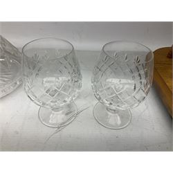 Stuart Crystal decanter and stopper, two Spiegelau brandy glasses, all marked beneath, and a stained oak stand raised on four feet