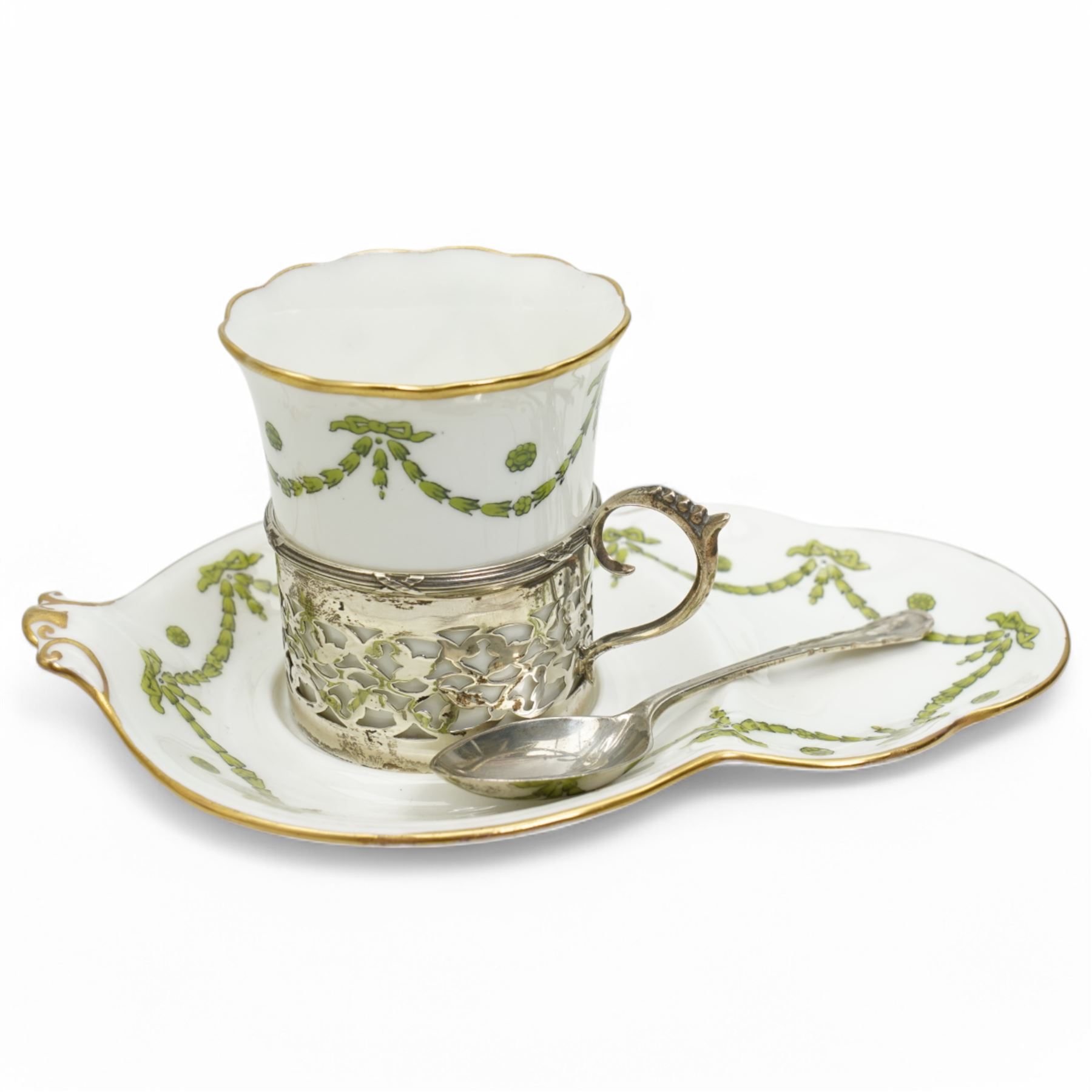 Set of Six Aynsley coffee cans and saucers decorated with garlands, the cans held in pierced silver holders Birmingham 1912 Maker Charles Green & Co and six silver spoons London 1939 Maker Josiah Williams & Co