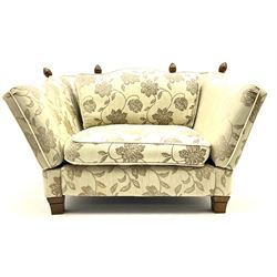 Knole ‘Snuggler’ drop arm sofa upholstered in pale fabric with raised floral pattern, with scatter cushions 