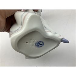 Four Lladro figures, comprising Afternoon Promenade no 7636, Nostalgia no 5071, both with original boxes, Girl with Lilies no 4972 and Madonna no 4534, largest example H27cm