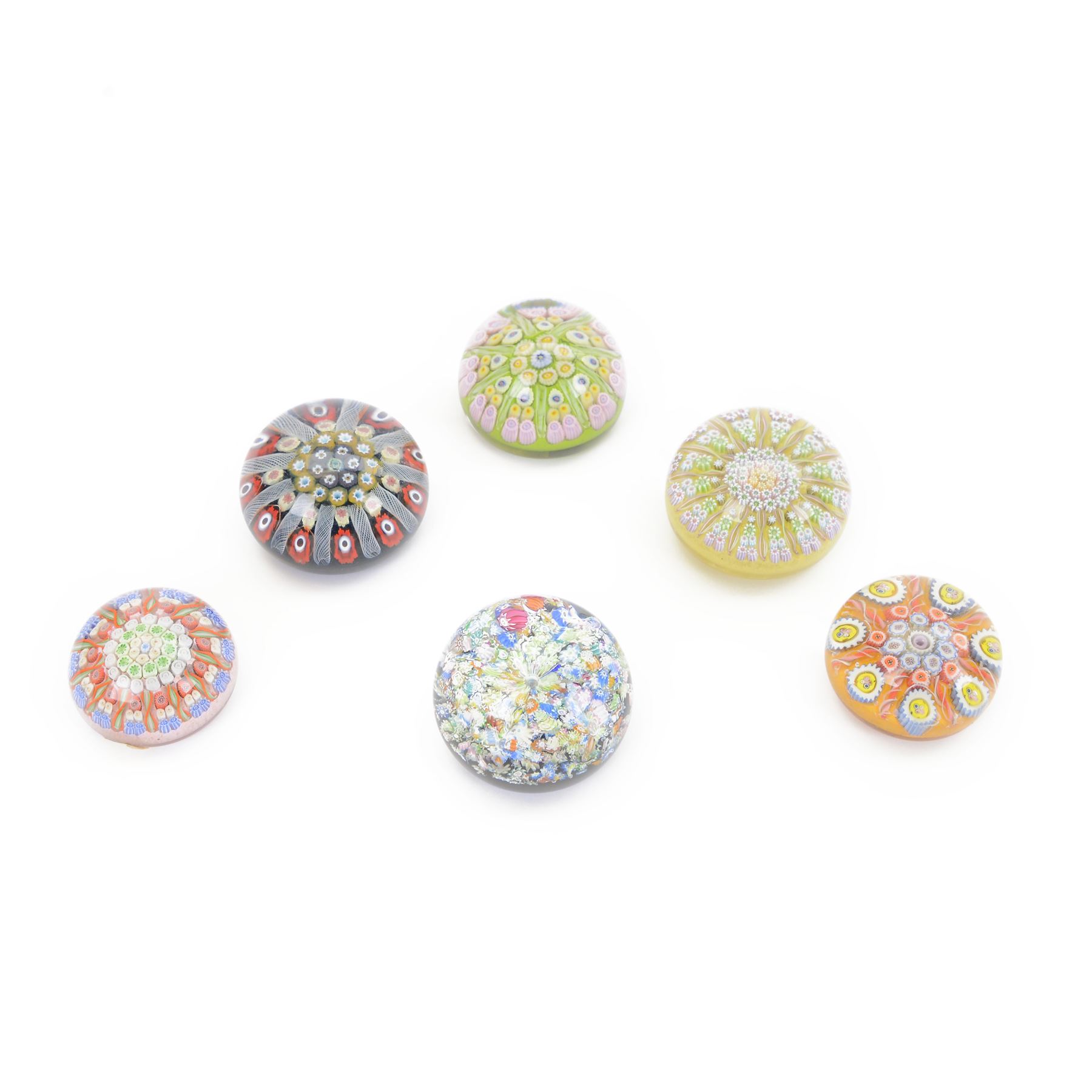 Six millefiori paperweights, including Perthshire paperweight of balubas form the millefiori canes in the form of a flower