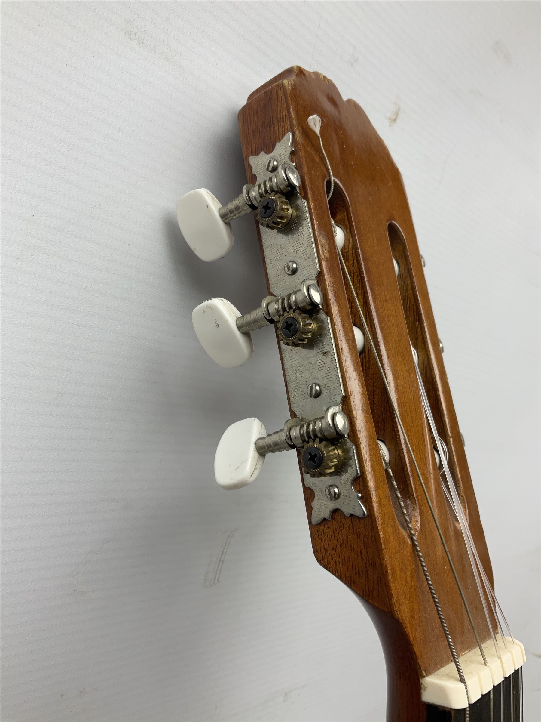 Spanish BM acoustic guitar with mahogany back and sides and spruce top L101cm; in cello carrying case; Roland foot pedal and two Yamaha foot pedals; tin D# organ pipe; folding music stand etc