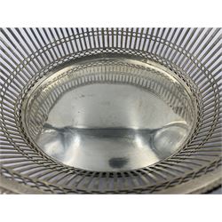 Early 20th century Dutch silver basket, of oval form with pierced sides, beaded rim, and twin handles, marked with Lion Passant for 2nd standard purity and date letter for 1910, other marks worn and indistinct, including handles H8.5cm L25.5cm