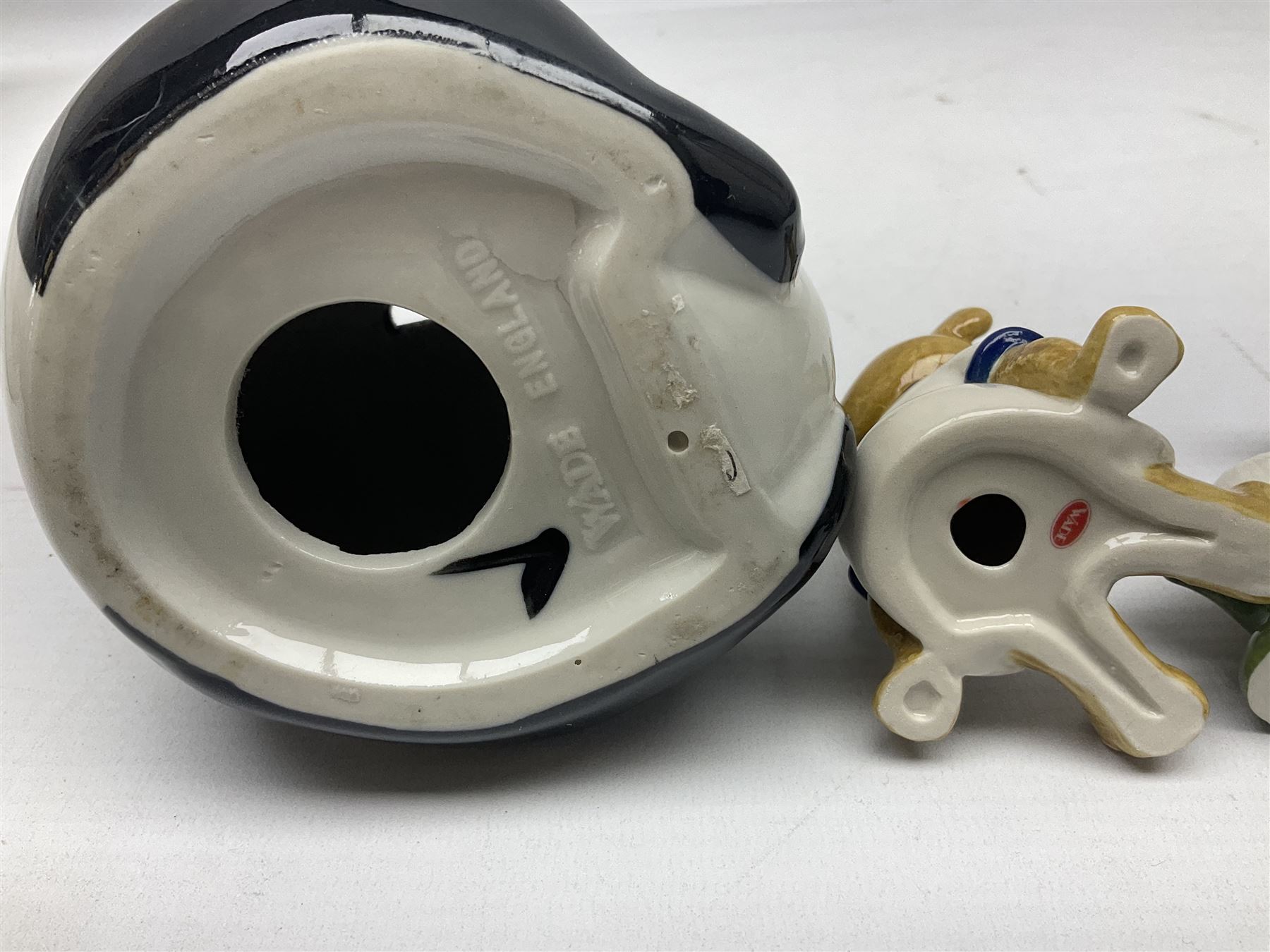 Nine Wade Collectables figures, comprising six Myths and Legends; King Canute, Mermaid, St George, Cornish Tin Mine Pixie, Puck and Green man, together with Lamb, Elephant and bear, a Wade Panda money box and two boxes of Wade Christmas Crackers