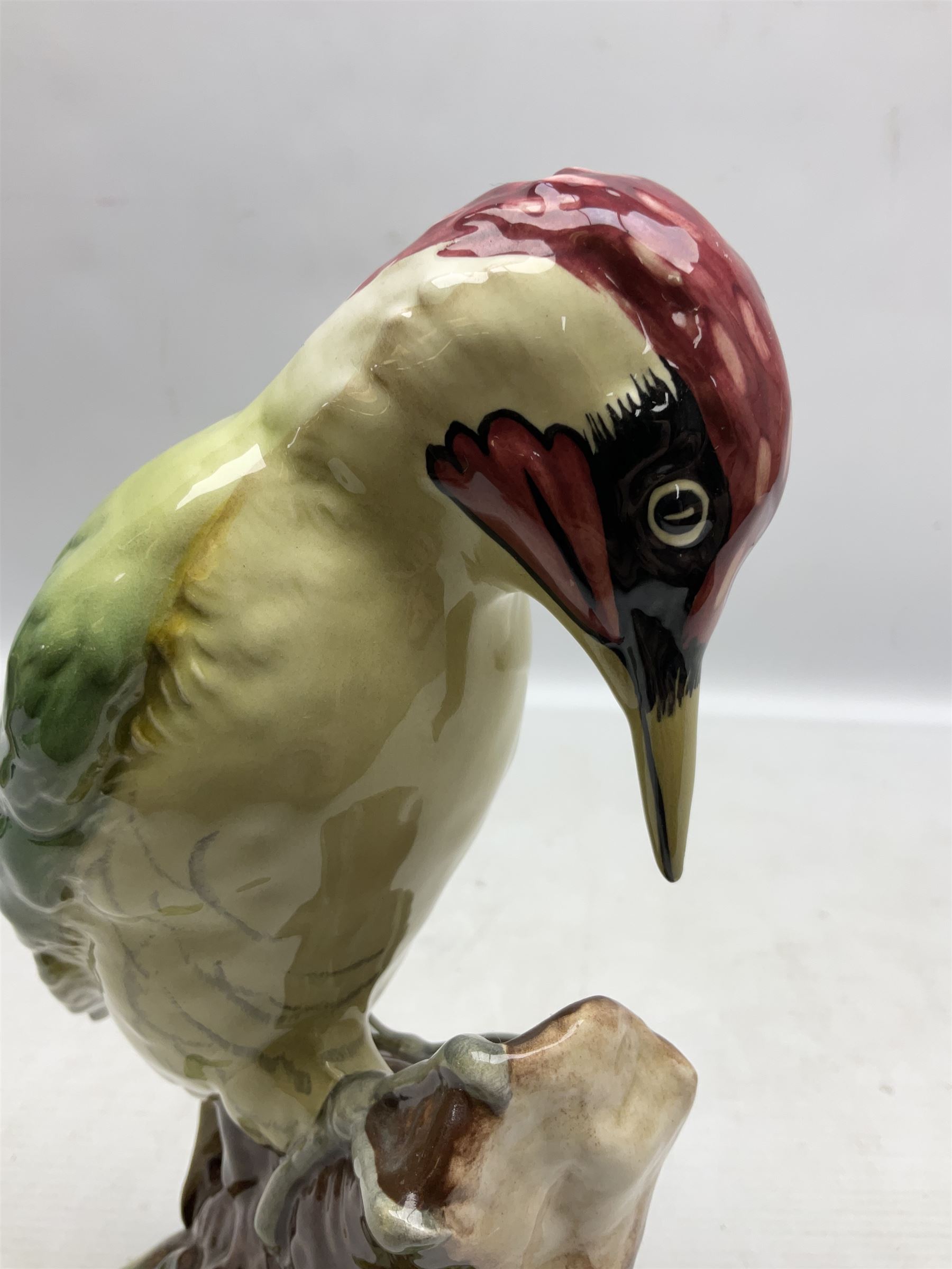 Three Beswick figures of birds, comprising pheasant no 1225, magpie no 2305 and woodpecker 1218, all with impressed marks beneath, tallest H22cm