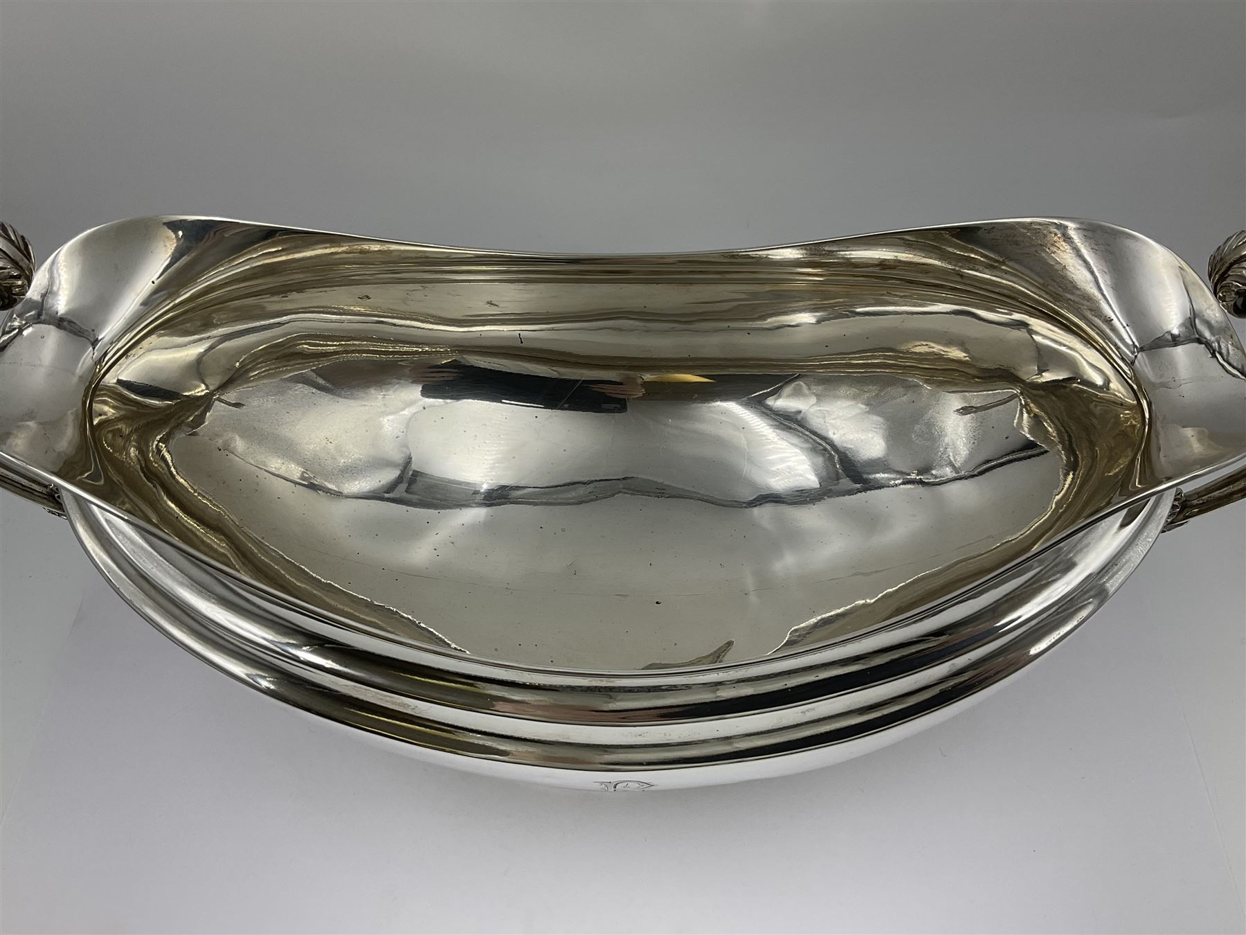1920s silver twin-handled pedestal bowl, of navette form with twin bifurcated acanthus capped scroll handles, engraved with initial R to body and upon spreading oval foot, hallmarked Hawksworth, Eyre & Co Ltd, Sheffield 1925, including handles H21.8cm