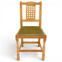 Beaverman - 1980s set of four lattice back dining chairs, shaped top rail above a lattice back, green leather fixed seat, raised on octagonal front supports, with carved Beaver to the back stretcher, by Colin Almack of Sutton near Thirsk