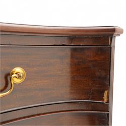 George III mahogany serpentine chest, moulded top over four cock-beaded drawers, the top drawer fitted with baize lined slide opening to reveal divisions,  enclosed by canted and fluted upright corners, the drawer fronts fitted with brass swan neck handles and circular plates with oval escutcheons, lower moulded edge over bracket feet, on lignum vitae castors