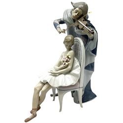 Large Lladro figure, Jester Serenade, modelled as a ballerina with bouquet of flowers seated before a jester playing the violin, with printed mark, impressed model number 5932 and signed beneath, H36.5cm