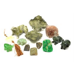 A group of jade, soapstone and hardstone, to include a jade pendant, jade frog, three soapstone pendants, nephrite jade elephant and frog, two soapstone trinket dishes modelled as leaves, etc. 