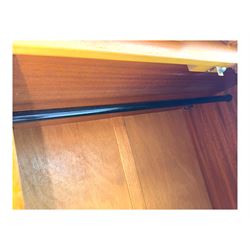 William Lawrence - mid-20th century teak double wardrobe, upper storage section over twin doors featuring recessed handles and contrasting horizontal panel, enclosing a hanging rail compartment, on plinth base with concealed castors