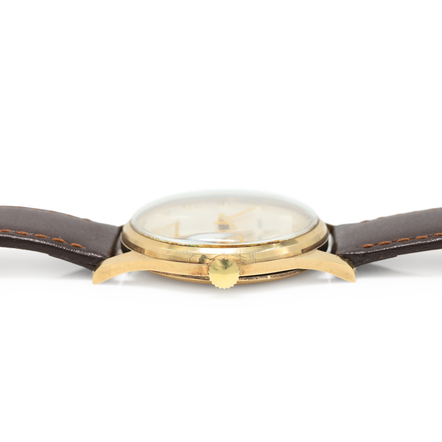 Garrard gentleman's 9ct gold manual wind wristwatch, silvered dial with Arabic hour markers and subsidiary seconds dial, the back case with personalised engraving, London 1974, on brown leather strap