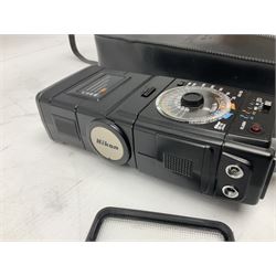 Nikon F3 SLR camera, serial number 1583609; Nikon 50mm 1:1.8 lens; Nikon 28-85mm 1:3.5-4.5 zoom lens; Vivitar MC 2X-3 Tele Converter, and a Nikon Speedlight SB-16 flash