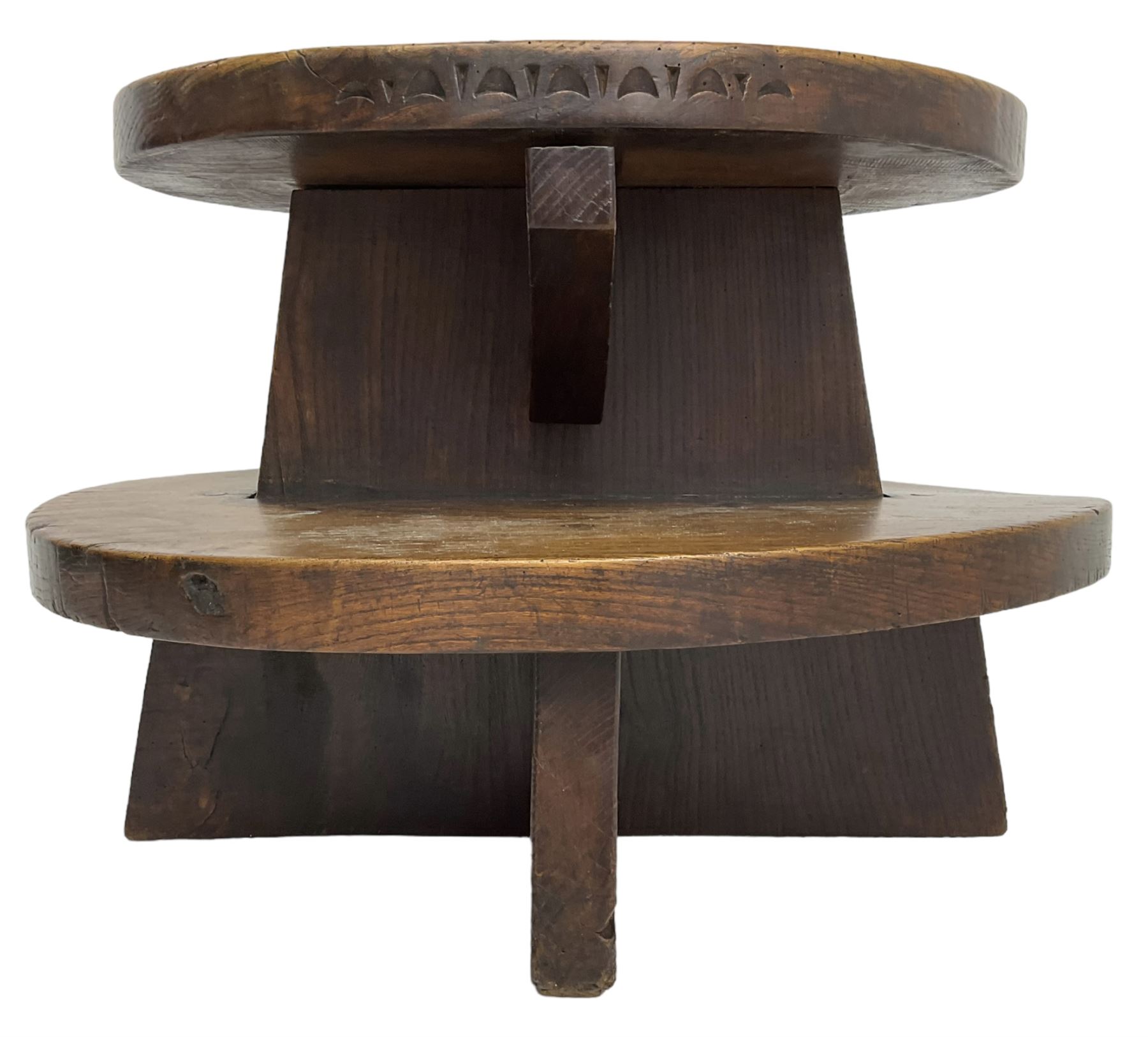 20th century figured elm occasional table, two oval tiers raised on cruciform base, the top tier carved with incised decoration 