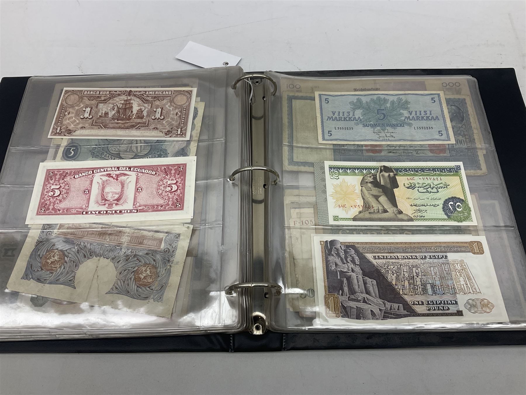 World banknotes, including Queen Elizabeth II The States of Jersey one pound 'DB202703', five pounds 'BB527762' and ten pounds 'AB651481', reserve bank of New Zealand two dollars '1L3 741894', King George V Straits Settlements one dollar 1st January 1935 'F/83 28924', various Bank of England notes etc, housed in two ring binder albums