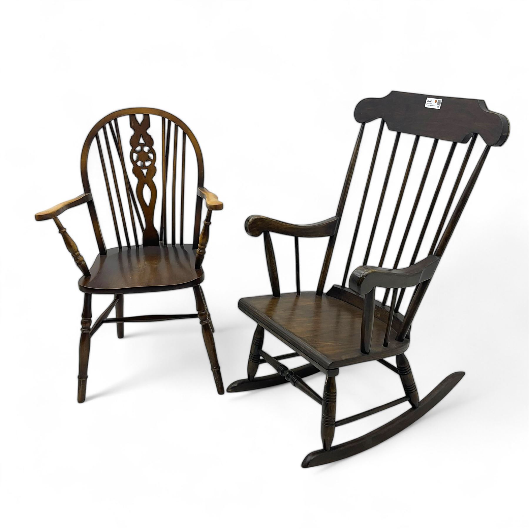 Early 20th century Windsor design rocking chair, shaped cresting rail over a spindle back, curved arms and plain seat, raised on turned supports with curved rockers; mahogany wheelback armchair raised on turned supports with H-stretcher 
