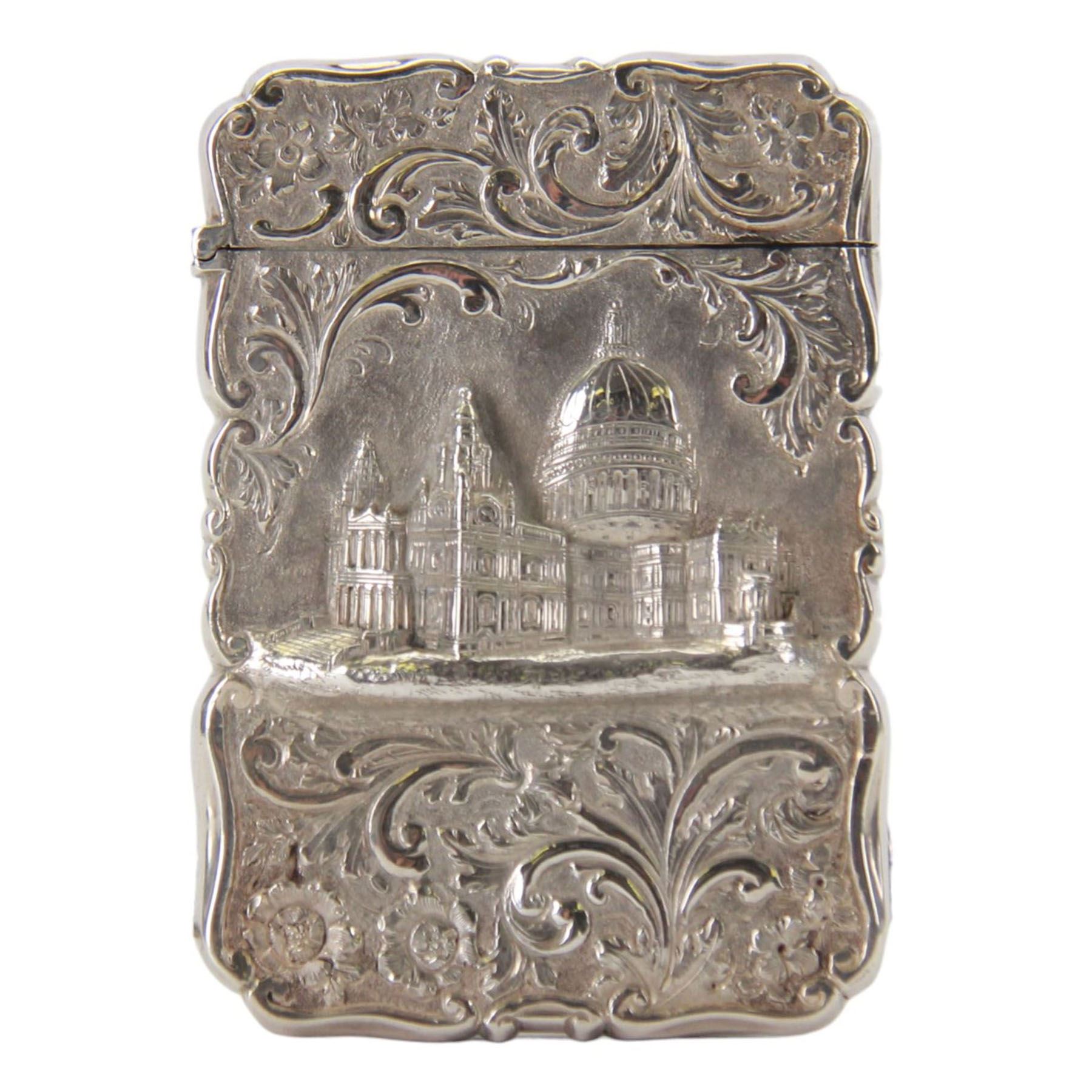 Victorian silver castle-top card case, of rectangular form with scrolling sides, relief embossed with the St Paul's Cathedral and surrounded by foliate scrolls, with vacant cartouche to reverse, hallmarked Nathaniel Mills, Birmingham, probably 1847, H8.5cm W6cm
