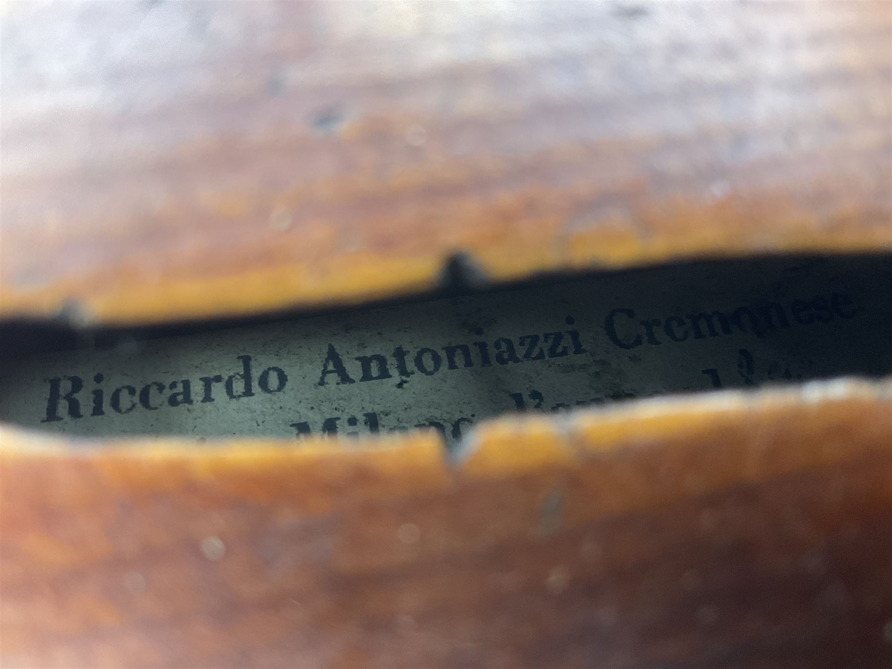 Mid-19th century German violin with 36cm two-piece maple back and ribs and spruce top, bears label 'Riccardo Antoniazzi Cremonese fece in Milano l'anno 1896' L59.5cm overall; in walnut case with two part bows
