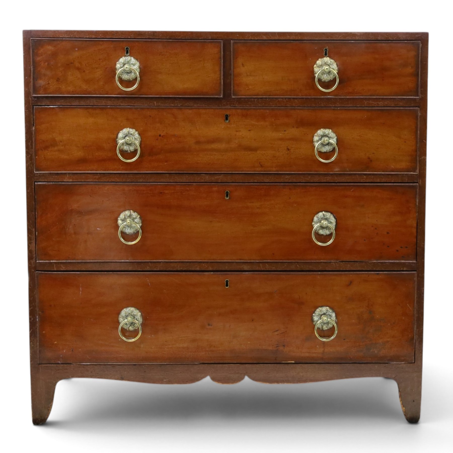 George III mahogany straight-front chest, two short over three long graduating drawers, cockbeaded edges with brass rose handles, raised on shaped supports
