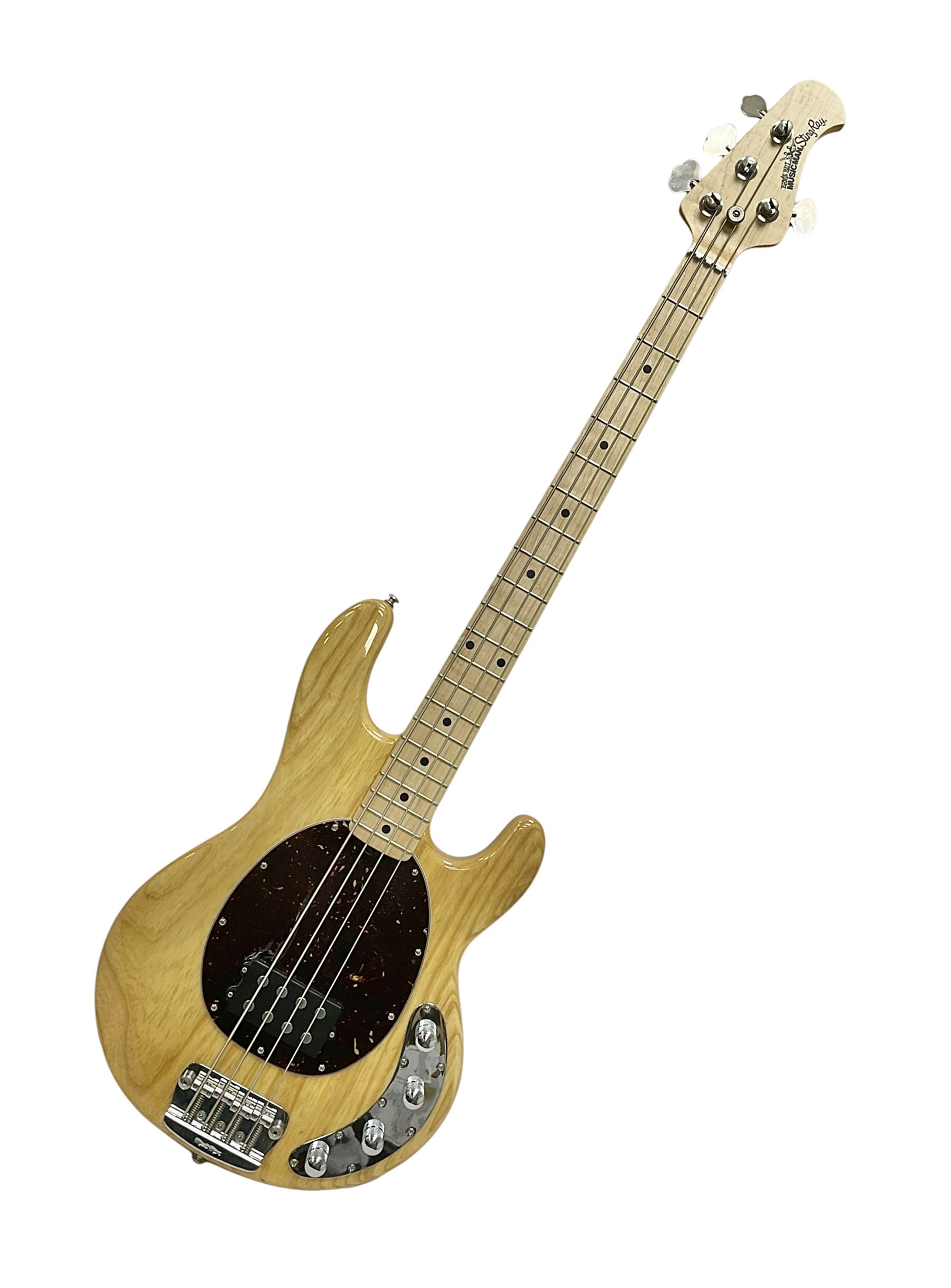 Ernie Ball Music Man Sting Ray 4 string bass guitar, in natural finish with roasted maple neck and tortoiseshell effect scratch guard, serial no 87485, in black Music Man hard case, guitar L114cm