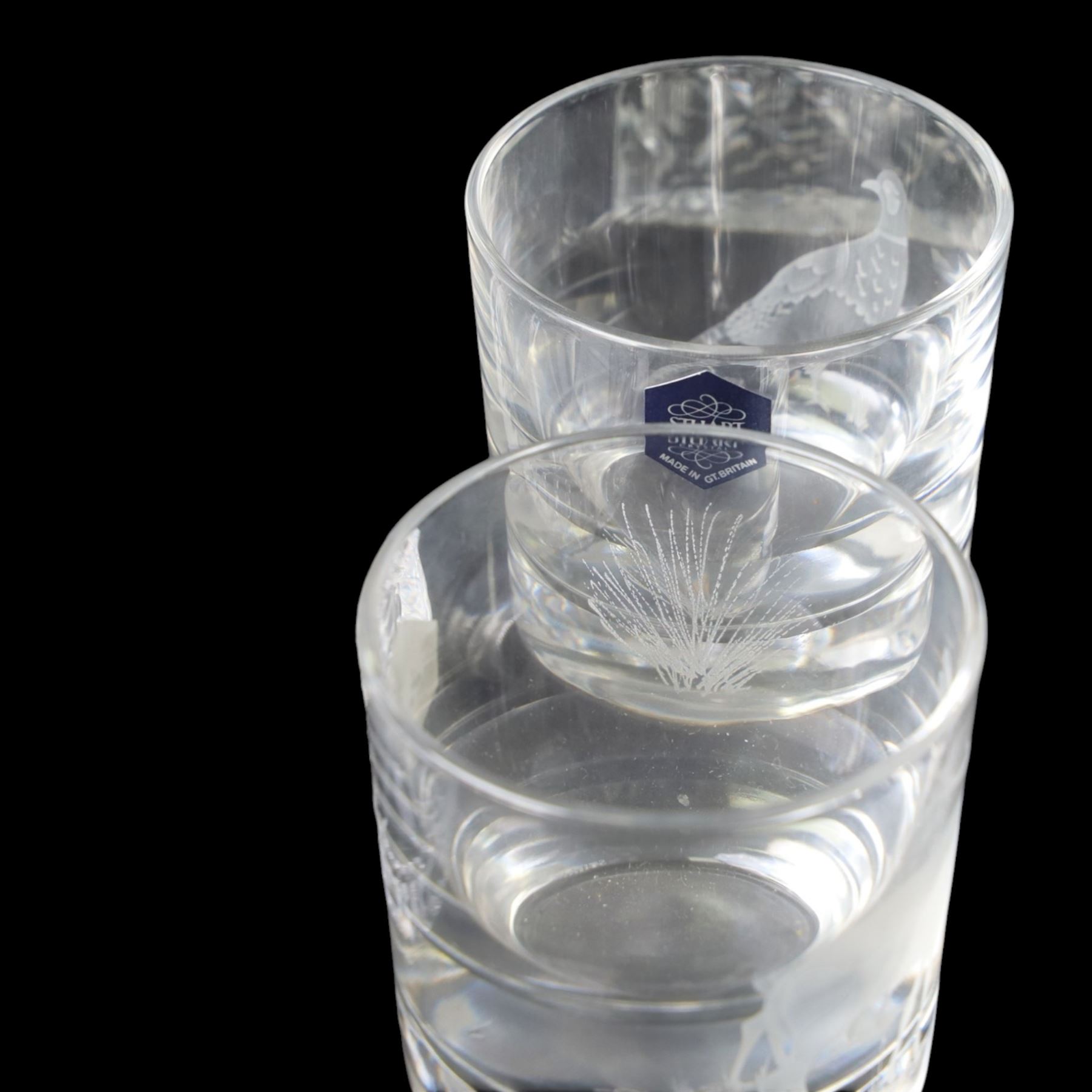 Four glass decanters with three silver labels for gin sherry and whisky, hallmarked Birmingham 1984, together with two Stuart Crystal vases and set of four Galloway glasses