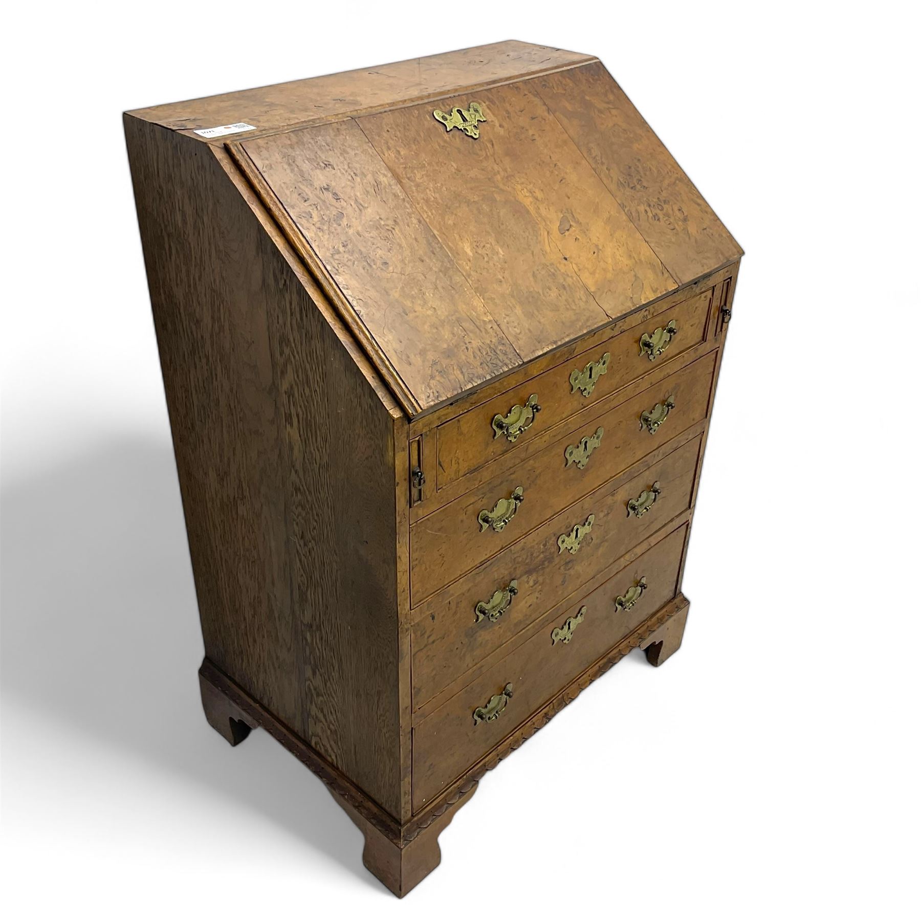 George III figured walnut bureau, fall-front enclosing central cupboard, six pigeonholes and six drawers, fitted with four graduated cockbeaded drawers, on bracket feet