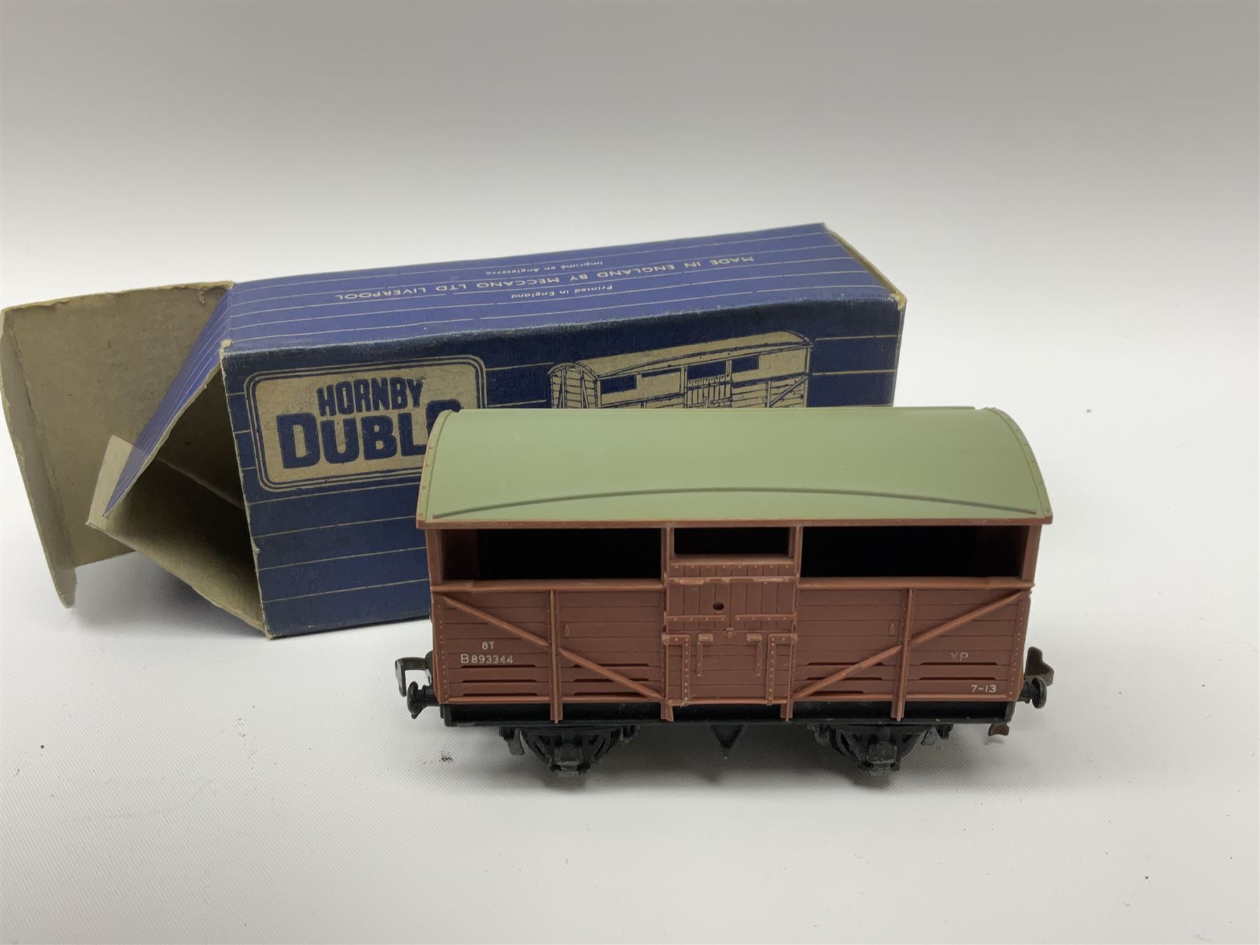 Hornby Dublo - twenty wagons including Cattle Trucks; Low-Sided Wagons; Cable Drum Wagons; Tank Wagon for Shell Lubricating Oil; Mineral Wagons; 20-Ton Bulk Grain Wagons; Goods Brake Vans; Furniture Containers etc; all in blue striped boxes (20)