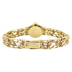 Omega ladies 9ct gold manual wind wristwatch, Ref. 7115674, silvered dial with baton hour markers, on 9ct gold pierced design bracelet, London 1972, with guarantee dated 1973