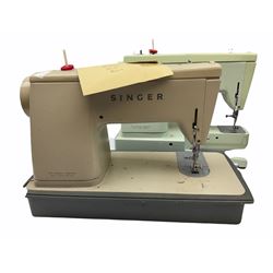 Two Singer sewing machines, model numbers 527 and 457, together with various Singer sewing machine parts, and a selection of sewing related accessories, to include threads, sewing needles, etc. 