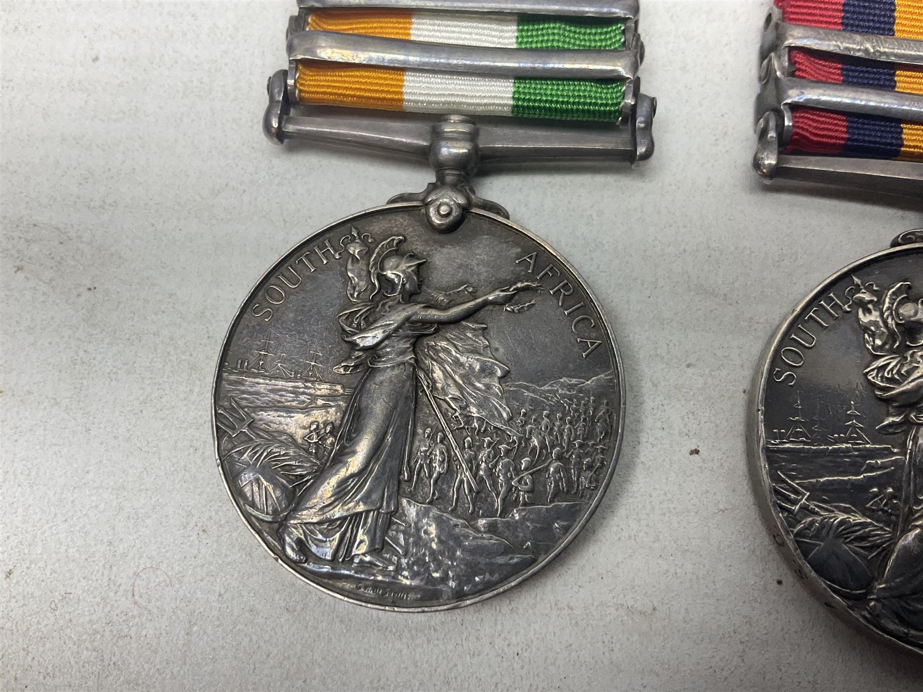 Boer War pair of medals comprising Queens South Africa Medal with two clasps for Paardeberg and Relief of Kimberley and Kings South Africa Medal with two clasps for South Africa 1901 & 1902, awarded to 9752 Dvr. T. Finan A.S.C. with ribbons (2)