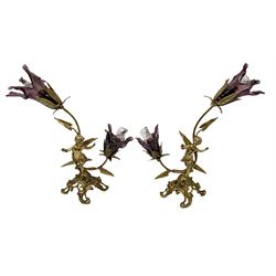 Pair of metal table lights, modelled as flowers with gilt leaves and ending in glass flowers, with a putti standing on a scrolled base, H41cm
