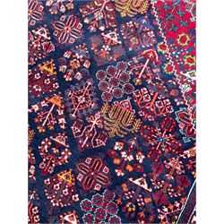 Persian Meimeh indigo ground rug, the central medallion within a field of small floral lozenge motifs, the guarded border with repeating pattern