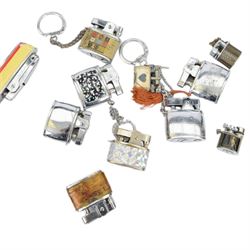 Large collection of lighters, including novelty gun and camera examples, Art Deco table lighter by Benlow Golmet, circular John F Kennedy example and other smoking accessories