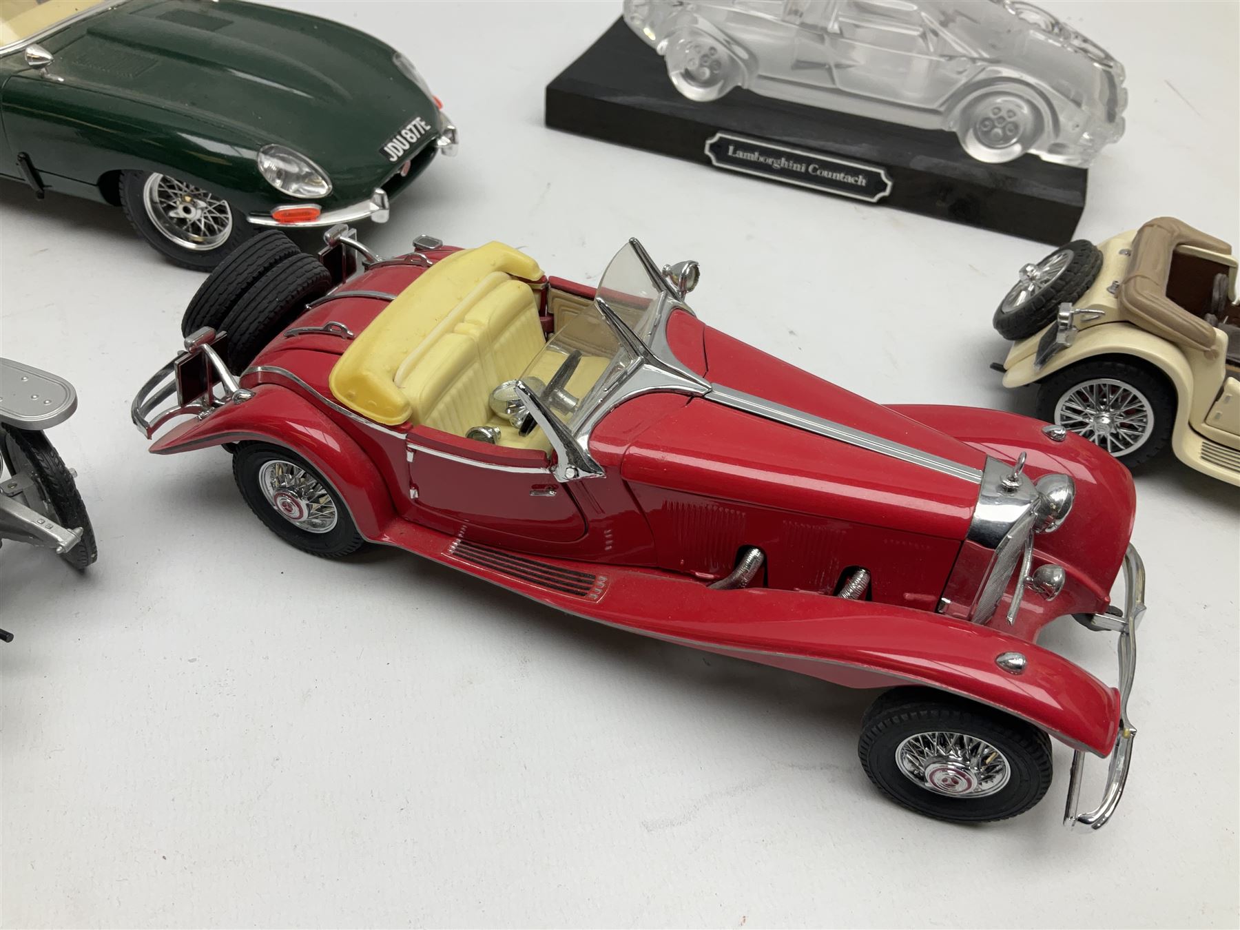 Three Franklin Mint die-cast models comprising 1935 Mercedes 500k Special Roadster, 1938 Jaguar SS-100 and 1907 Rolls Royce The Silver Ghost, together with Hof Bauer glass Lamborghini Countach
model and Bburago Jaguar 1961 'E' type