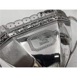 Victorian silver four piece tea service, comprising teapot, teapot stand, twin handled open sucrier and milk jug, each of octagonal form with foliate bud border and engraved decoration including crest to canted panels, and vacant panels, the teapot with ivory finial to the hinged cover and later wooden handle, hallmarked Edward Barnard & Sons Ltd, London1896, teapot including finial H15cm, milk jug including handle H16cm, teapot stand W11.5cm

This item has been registered for sale under Section 10 of the APHA Ivory Act