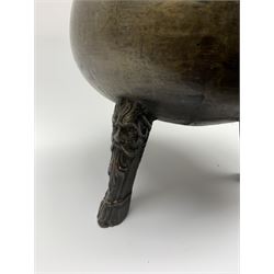 17th century bronze cauldron, probably German or Austrian, of bellied form with twin angular handles supporting a twisted handle, upon three splayed zoomorphic bearded mask feet, not including handle H30cm, rim D22cm