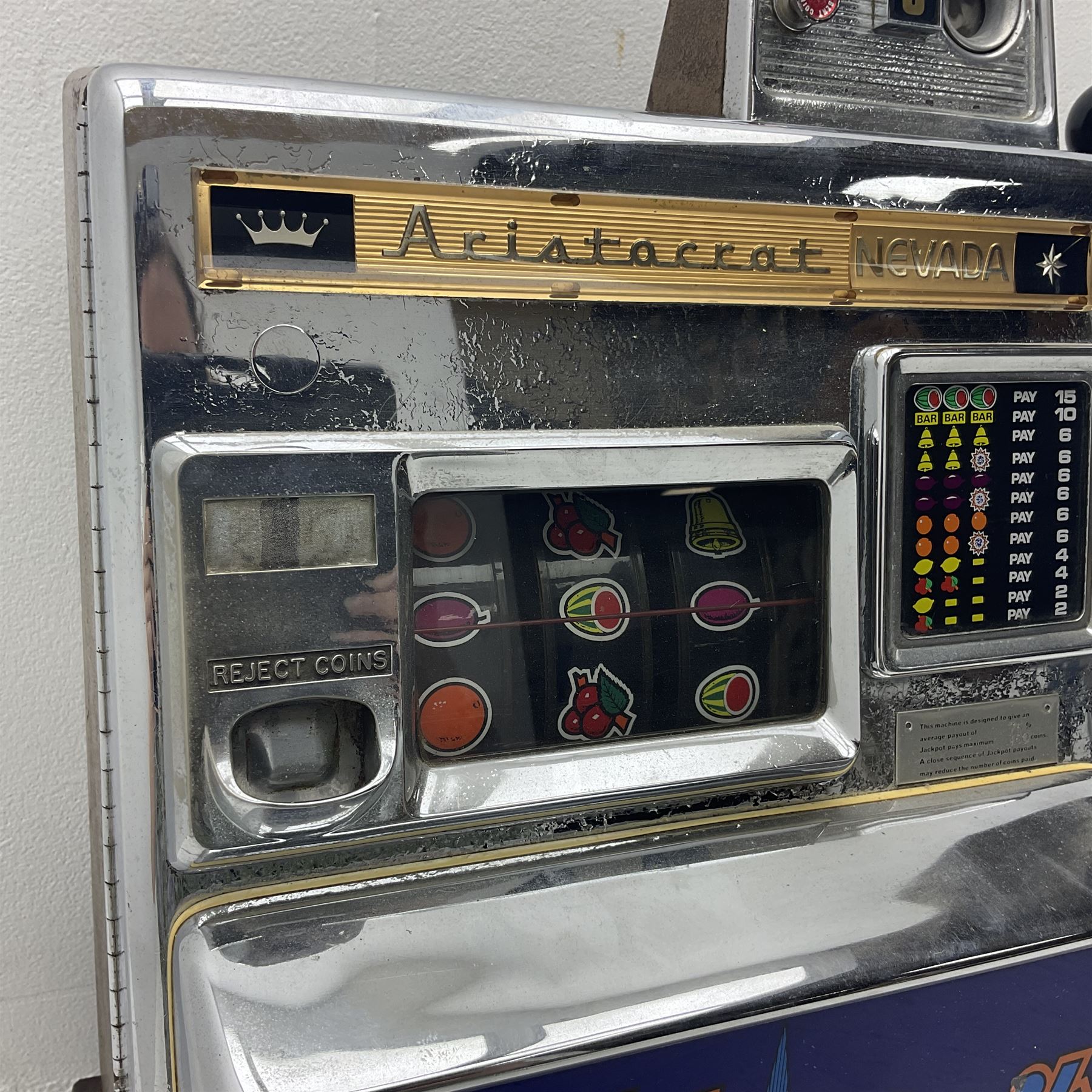 Aristocrat Nevada Lucky Strike one-armed bandit arcade machine, circa 1964, light-up display in aluminium and stainless steel case, with keys, H72cm 