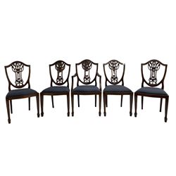 Set of five Georgian style mahogany dining chairs, pierced and carved backs, drop in seats upholstered in blue cover, on square tapering supports with spade feet