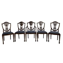 Set of five Georgian style mahogany dining chairs, pierced and carved backs, drop in seats upholstered in blue cover, on square tapering supports with spade feet